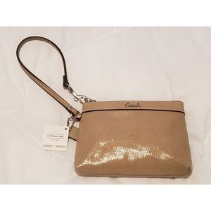 Coach tan patent leather perforated wristlet